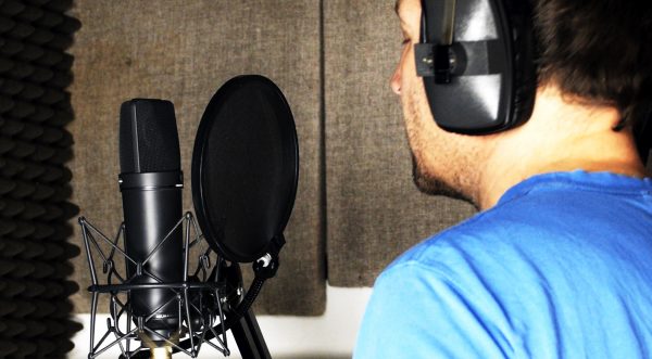 Jonathan Slatter recording vocals in the booth on a U87 microphone